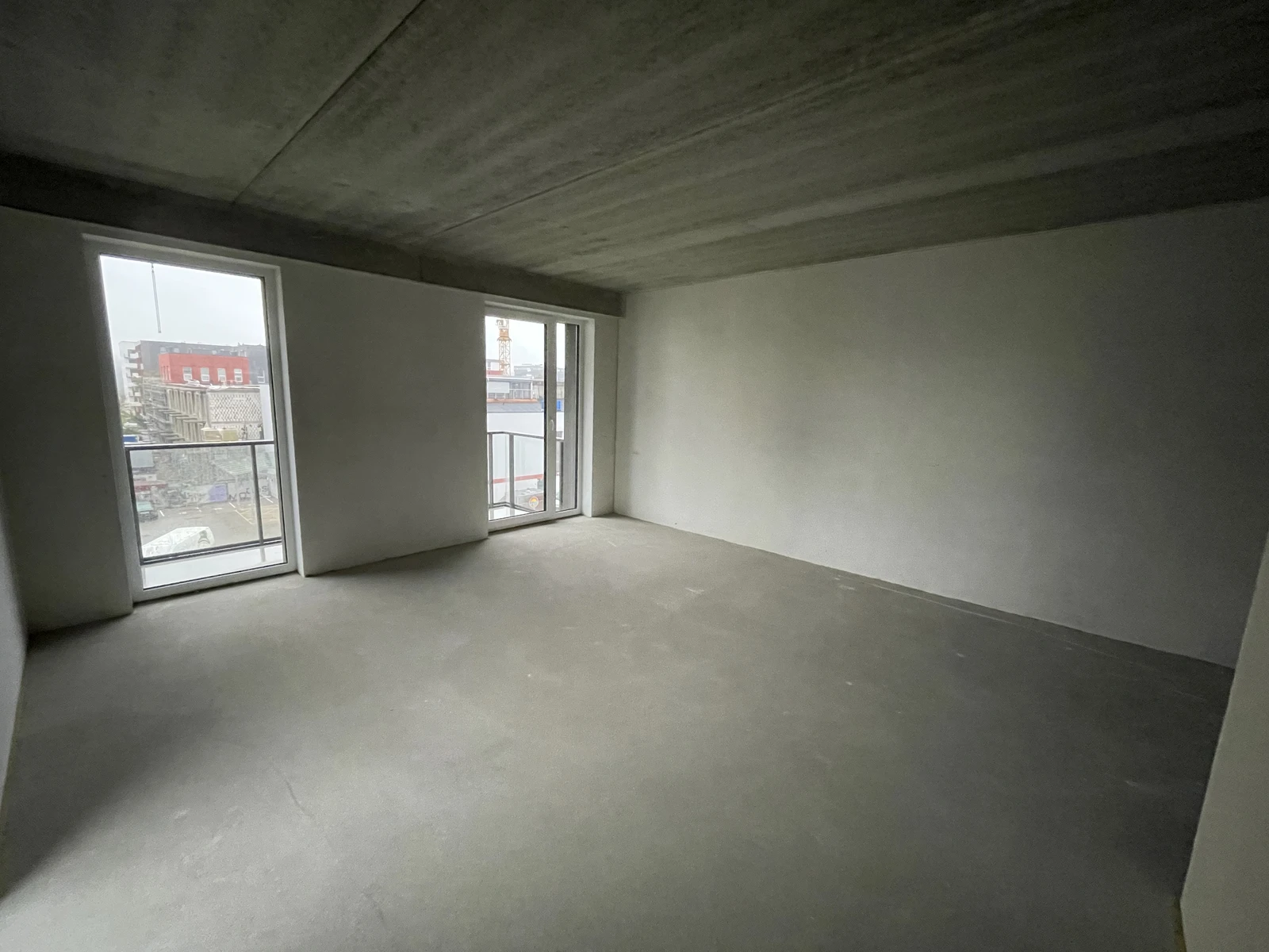 The original apartment shell viewed towards the windows, before the rooms, finishes and fitted furniture were completed.