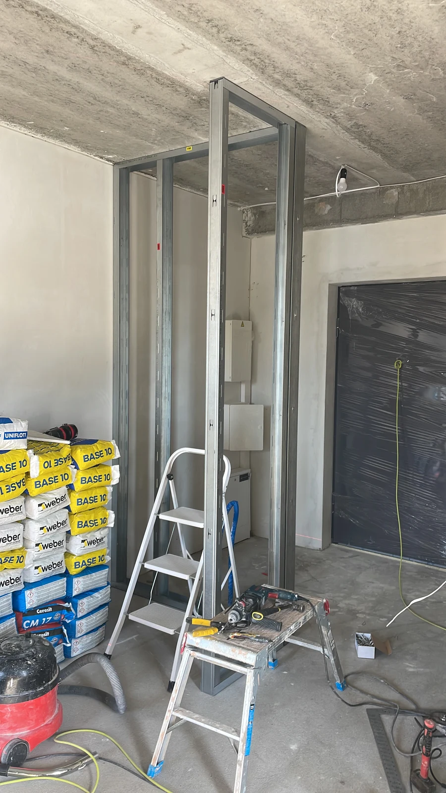 Metal studwork being installed to form the new internal layout.