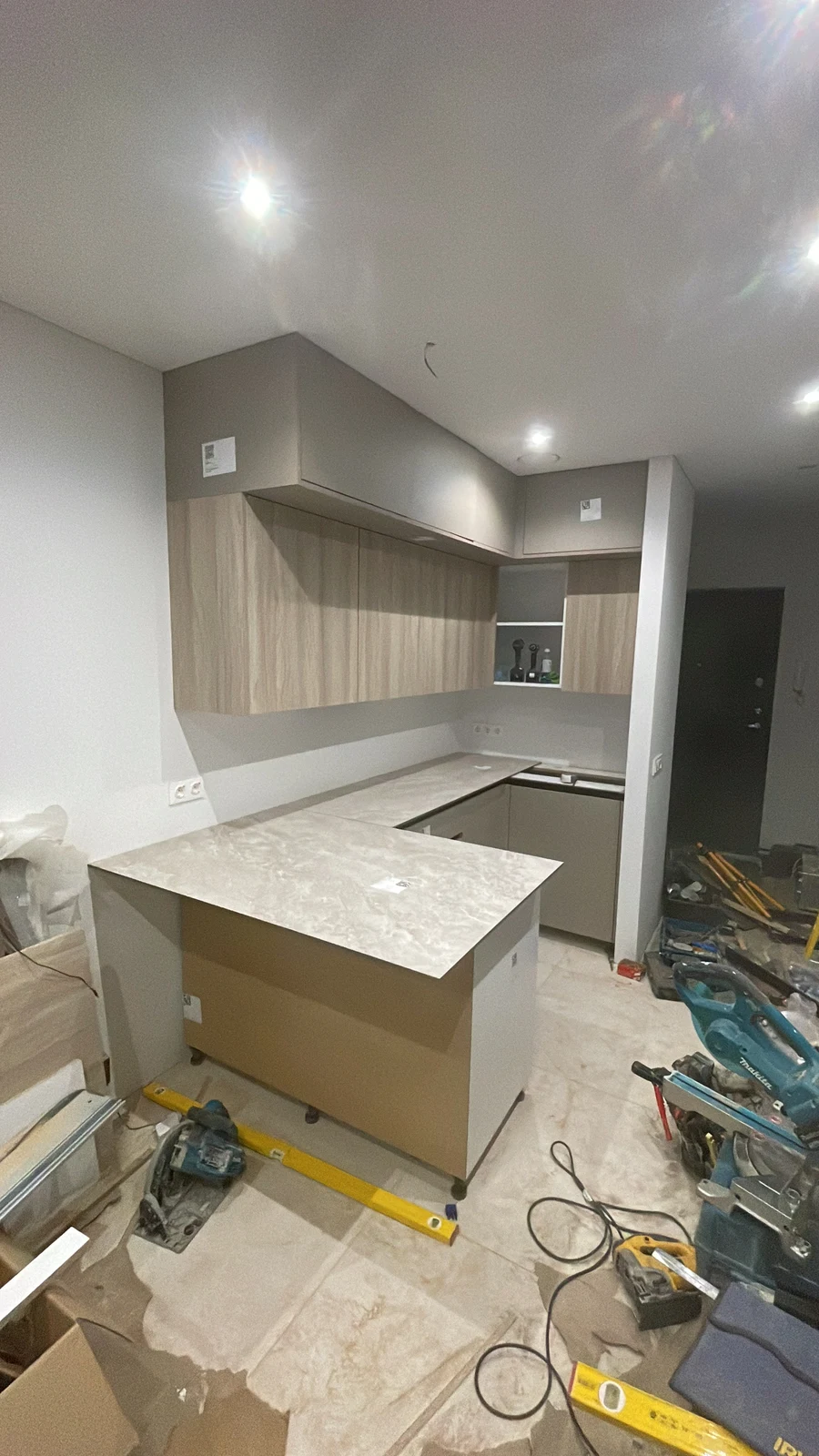 Kitchen cabinetry and the island during installation.