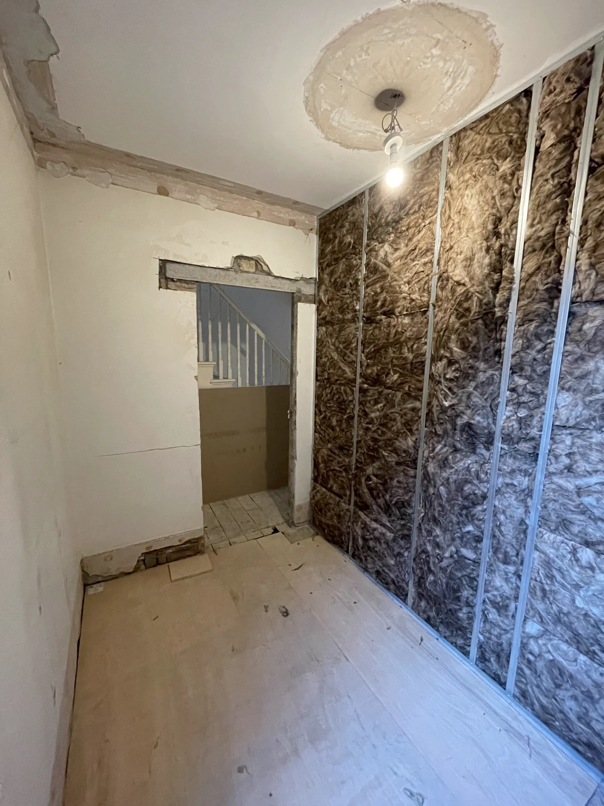 Wall insulation fitted between framing before boarding