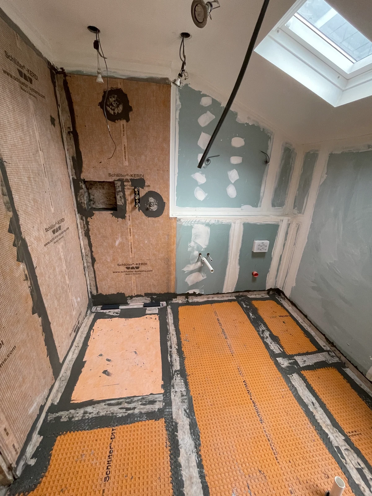 Bathroom floor membrane and shower wall boards before tiling