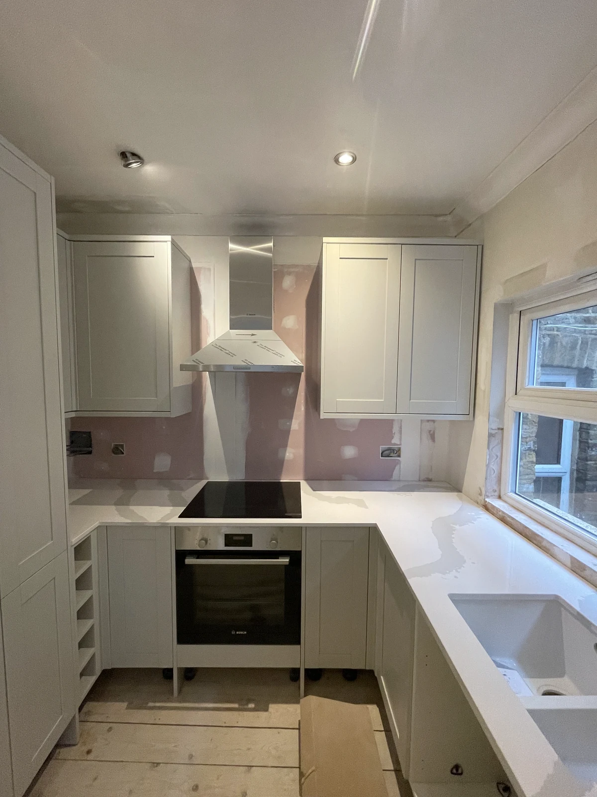 Kitchen cabinets, worktop and appliances being fitted