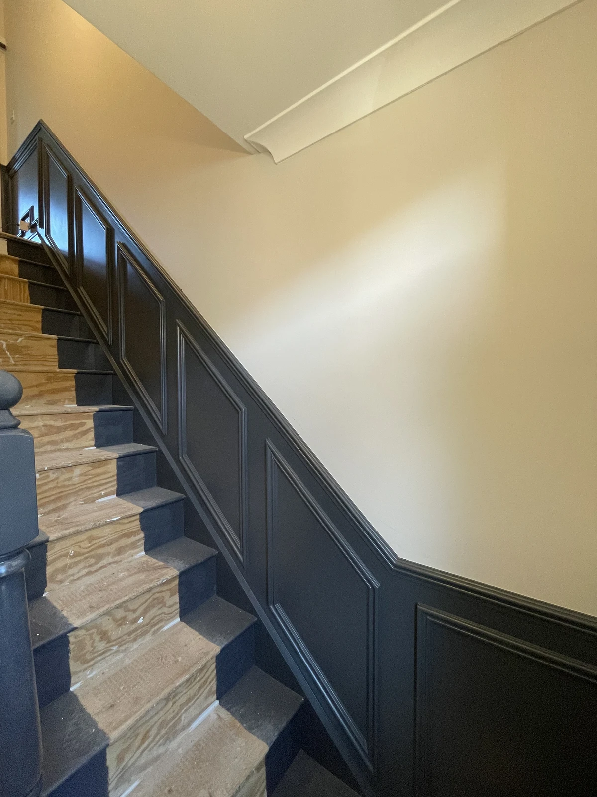 Decorative stair panelling with exposed timber treads.