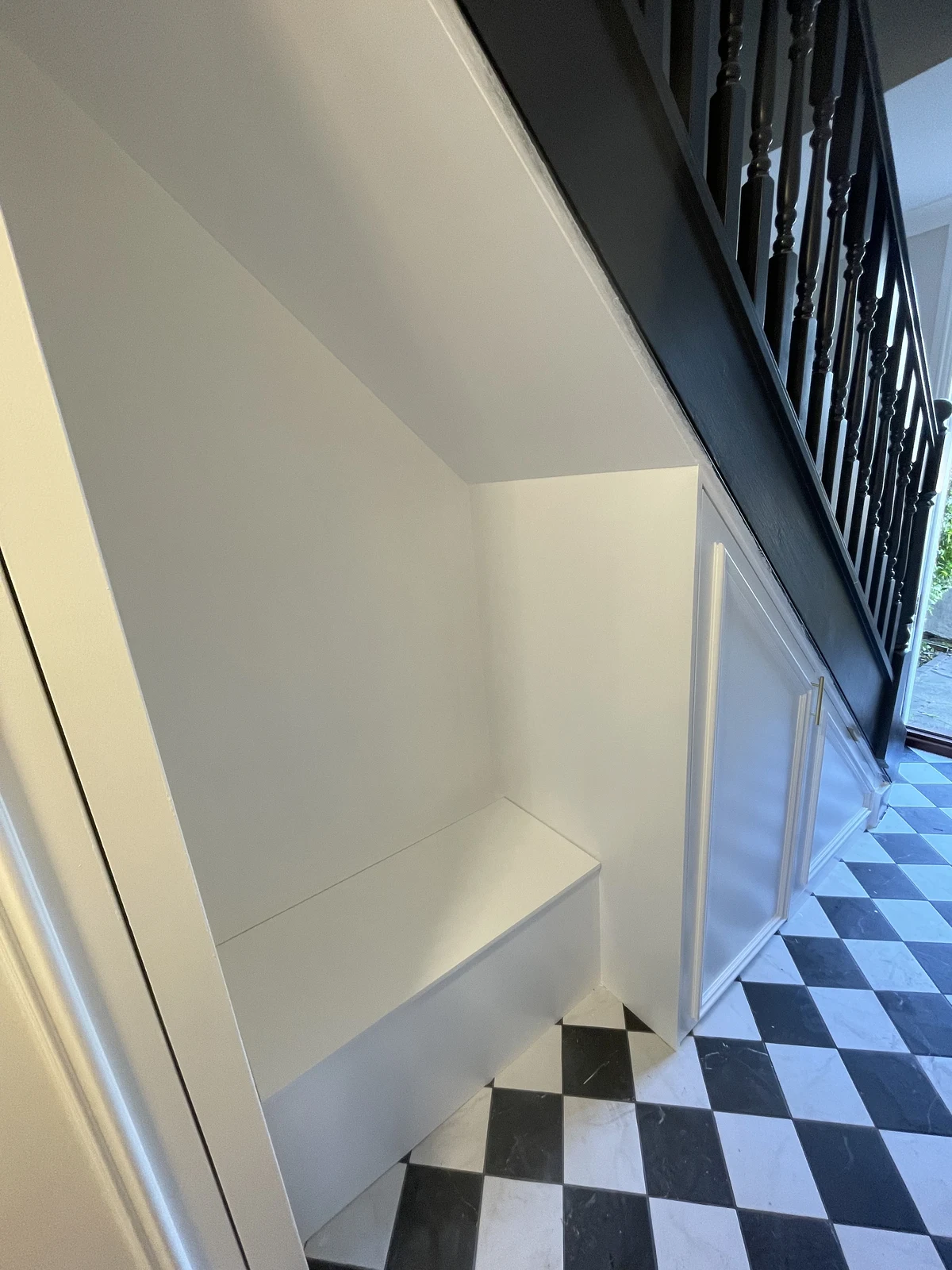 Painted panelling beneath the staircase.