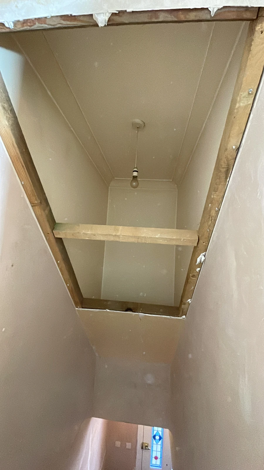 Landing ceiling framing during the work.