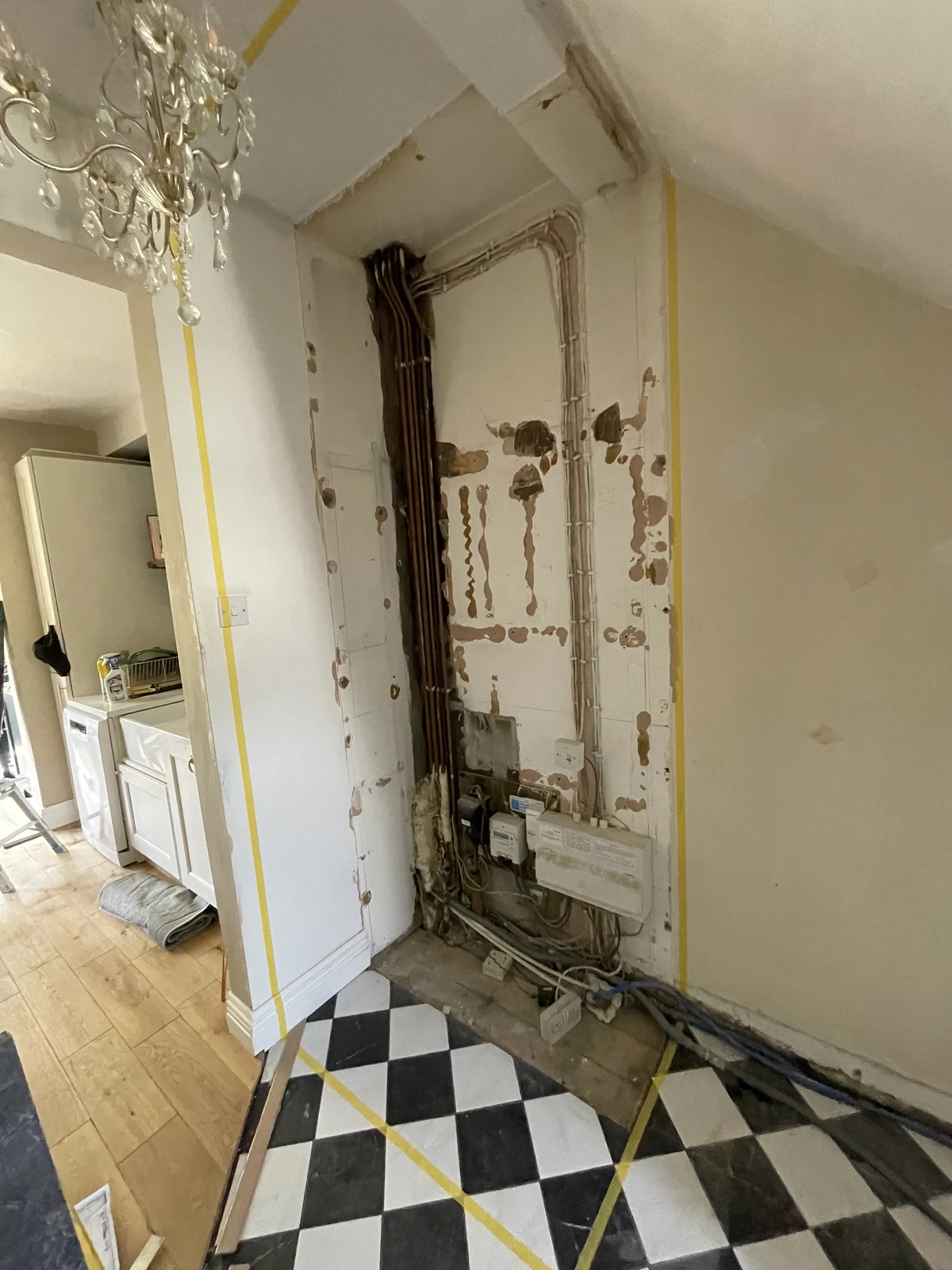 Hallway services exposed before the new storage was built.