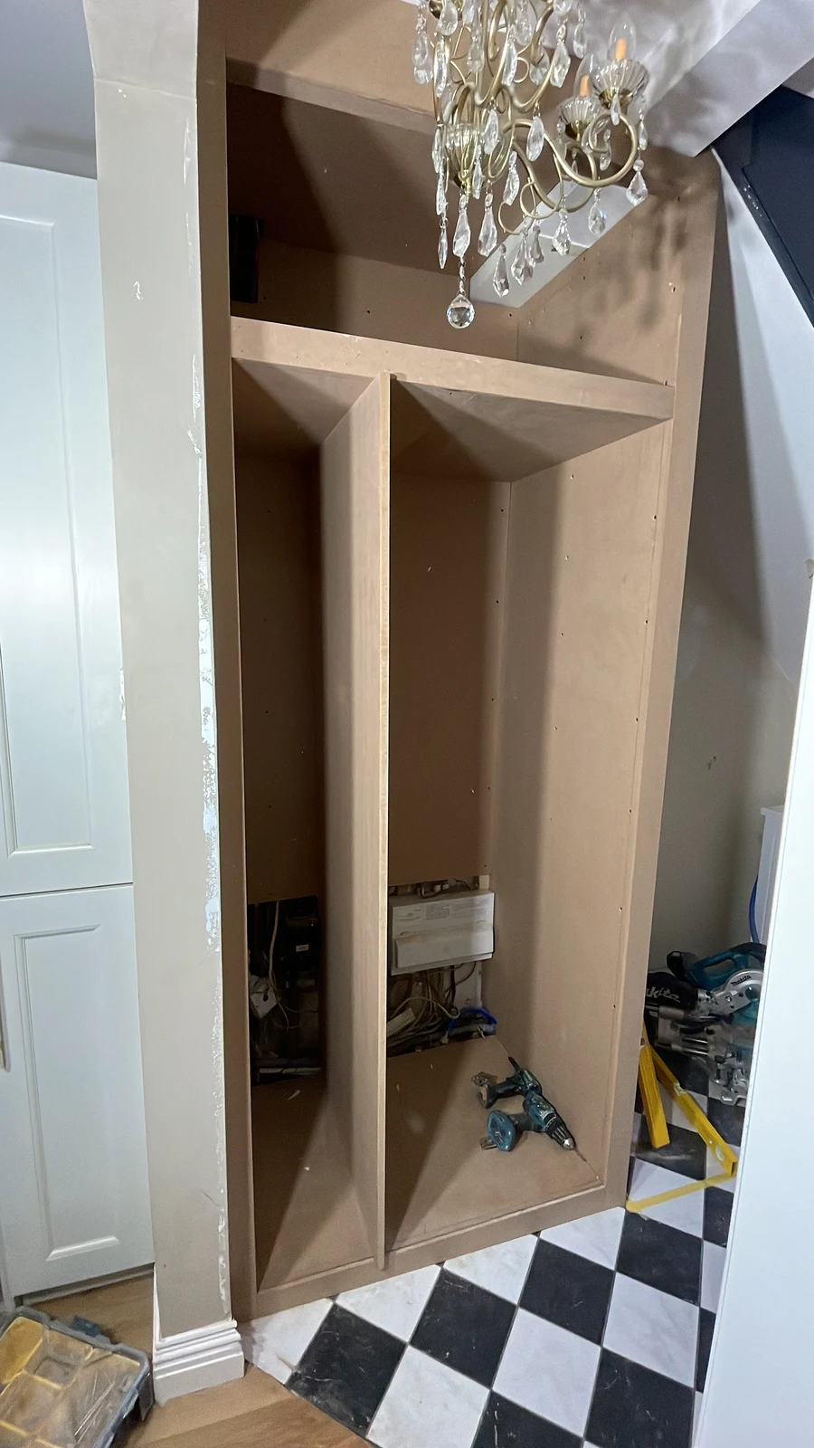 Bespoke hallway storage carcasses during construction.