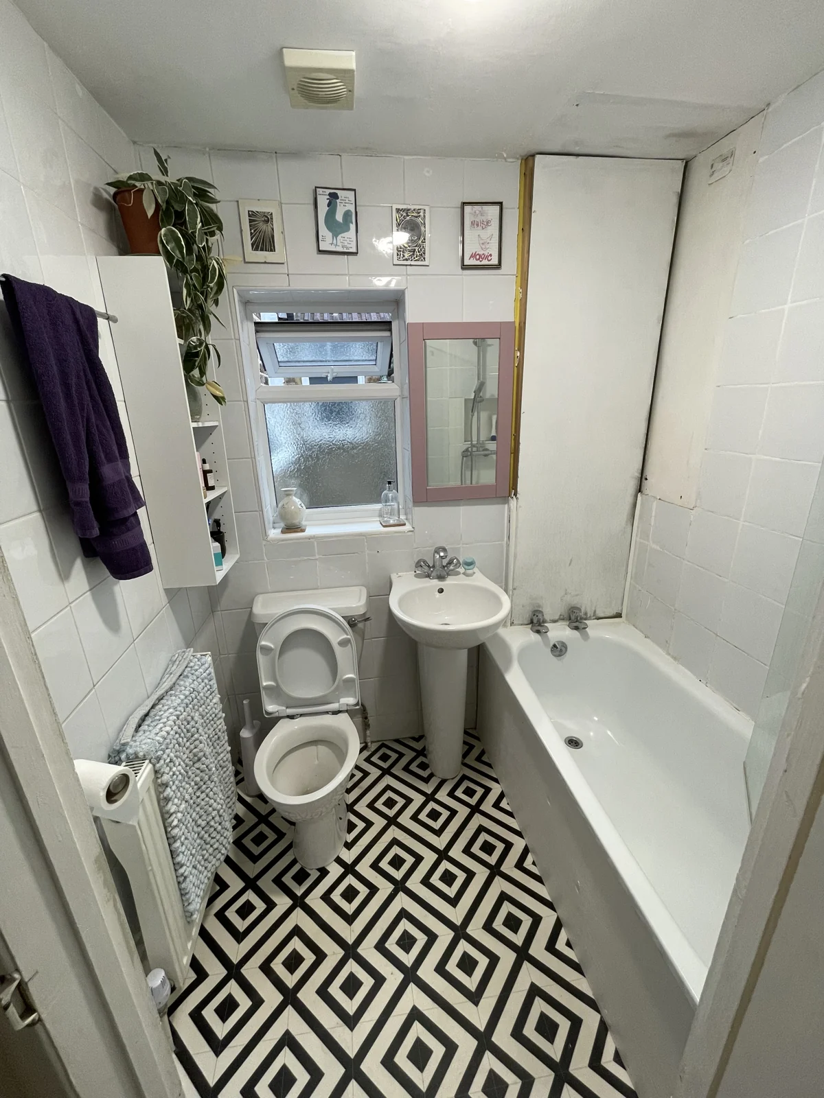 The original bath, basin and toilet in the compact bathroom